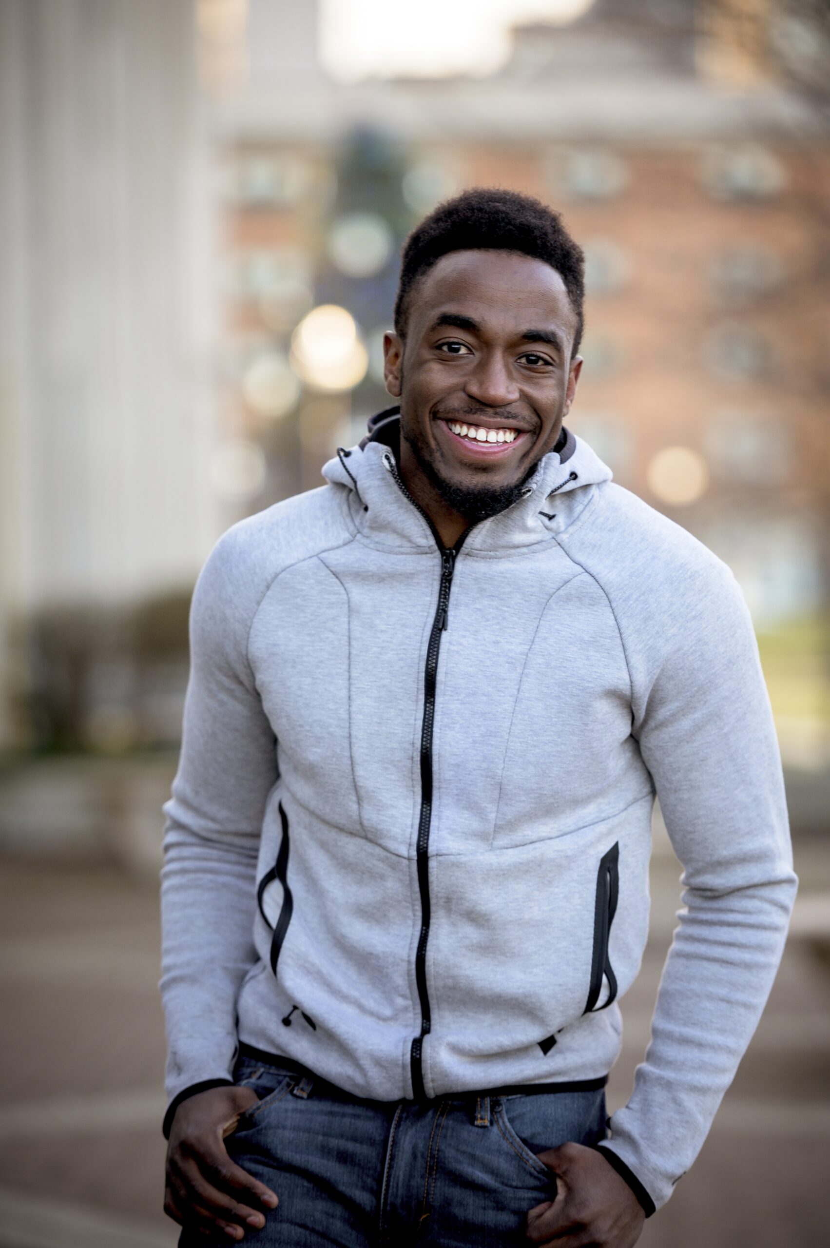 Vertical shot of an attractive African American male smiling at the camera